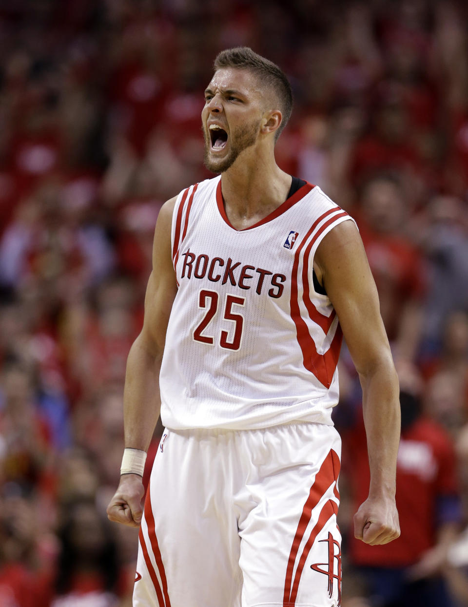 Houston Rockets' Chandler Parsons (25) reacts after making a three-point basket against the Portland Trail Blazers during the second quarter in Game 1 of an opening-round NBA basketball playoff series Sunday, April 20, 2014, in Houston. (AP Photo/David J. Phillip)