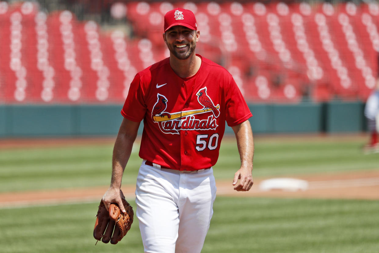 St. Louis Cardinals pitcher Adam Wainwright smiles after throwing a simulated inning during baseball practice at Busch Stadium Sunday, July 5, 2020, in St. Louis. (AP Photo/Jeff Roberson)