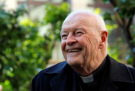 FILE PHOTO: Cardinal Theodore Edgar McCarrick smiles during an interview with Reuters at the North American College at the Vatican February 14, 2013. REUTERS/Alessandro Bianchi/Files