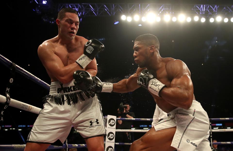 Anthony Joshua was always in command against the previous;y unbeaten Joseph Parker (left)