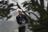 Li Haotong of China, watches his tee shot on the fourth hole during the third round of the PGA Championship golf tournament at TPC Harding Park Saturday, Aug. 8, 2020, in San Francisco. (AP Photo/Jeff Chiu)