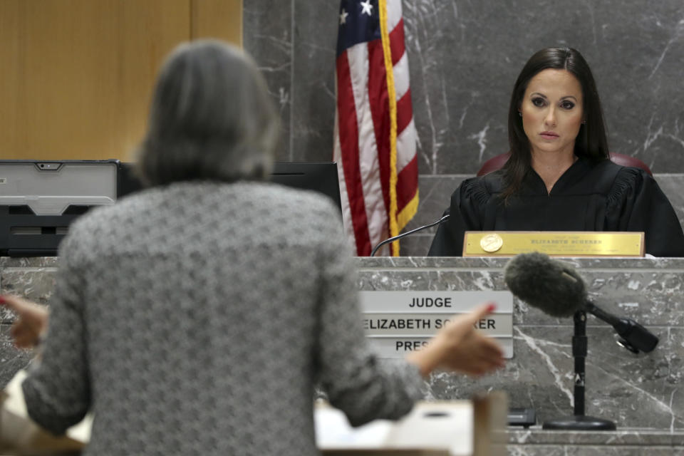 Judge Elizabeth Scherer looks towards Prosecutor Maria Schneider during a pre-trial hearing at the Broward County Courthouse in Fort Lauderdale, Fla., Wednesday, July 14, 2021, on four criminal counts stemming from Parkland school shooter Nikolas Cruz's alleged attack on a Broward jail guard in November 2018. Cruz is accused of punching Sgt. Ray Beltran, wrestling him to the ground and taking his stun gun. (Amy Beth Bennett/South Florida Sun-Sentinel via AP, Pool)