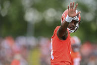 Cleveland Browns quarterback Deshaun Watson waves to fans during an NFL football practice in Berea, Ohio, Sunday, Aug. 14, 2022. (AP Photo/David Dermer)