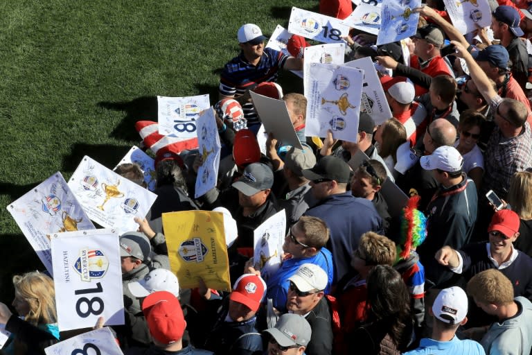 Patrick Reed of the US signs autographs for fans during practice prior to the 2016 Ryder Cup at Hazeltine National Golf Club on September 29, 2016 in Chaska, Minnesota