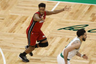 Miami Heat guard Kyle Lowry, left, reacts toward officials during the second half of Game 2 of the NBA basketball playoffs Eastern Conference finals against the Boston Celtics in Boston, Friday, May 19, 2023. (AP Photo/Michael Dwyer)