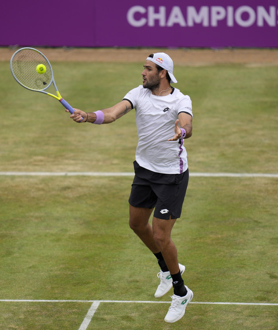 Matteo Berrettini of Italy plays a return to Andy Murray of Britain during their singles tennis match at the Queen's Club tournament in London, Thursday, June 17, 2021. (AP Photo/Kirsty Wigglesworth)