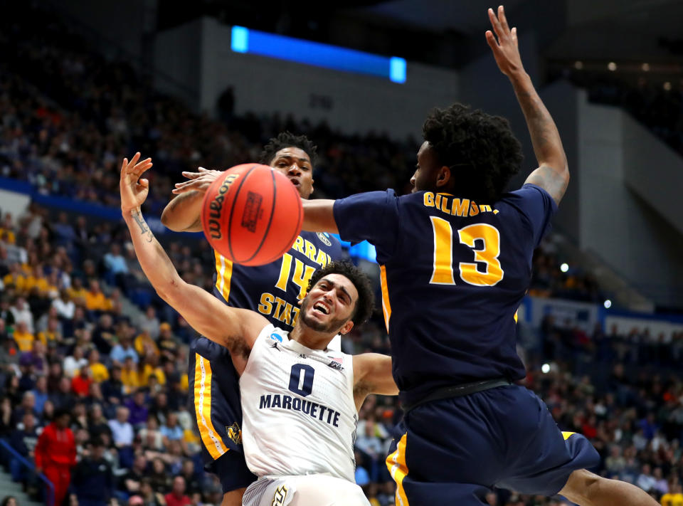<p>Markus Howard #0 of the Marquette Golden Eagles is fouled while playing the Murray State Racers during the first round game of the 2019 NCAA Men’s Basketball Tournament at XL Center on March 21, 2019 in Hartford, Connecticut. (Photo by Maddie Meyer/Getty Images) </p>