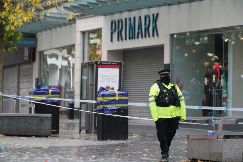 Police near the scene of the stabbing (Peter Byrne/PA) (PA Wire)
