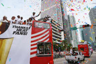 MIAMI, FL - JUNE 25: Dwyane Wade of the Miami Heat rides in a victory parade through the streets during a celebration for the 2012 NBA Champion Miami Heat on June 25, 2012 in Miami, Florida. The Heat beat the Oklahoma Thunder to win the NBA title. (Photo by Joe Raedle/Getty Images)
