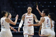 FILE - Phoenix Mercury's Brittney Griner (42) is congratulated on a play against the Seattle Storm in the first half of the second round of the WNBA basketball playoffs Sunday, Sept. 26, 2021, in Everett, Wash. Brittney Griner said she's “grateful” to be back in the United States and plans on playing basketball again next season for the WNBA's Phoenix Mercury a week after she was released from a Russian prison and freed in a dramatic high-level prisoner exchange. “It feels so good to be home!” Griner posted to Instagram on Friday, Dec. 16, 2022, in her first public statement since her release. (AP Photo/Elaine Thompson, File)