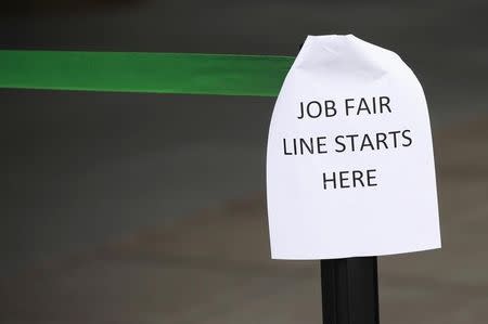 A sign marks the entrance to a job fair in New York October 24, 2011. REUTERS/Shannon Stapleton