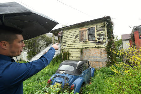 Emeryville Vice-Mayor John Bauters gestures to a neglected property in Emeryville, California, United States March 20, 2017. REUTERS/Noah Berger