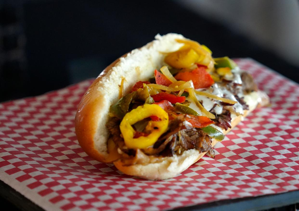 Montgomery Inn Brisket Hoagie is made with brisket and topped with peppers, onions, banana peppers, queso cheese and barbecue sauce served on a potato sub roll. It will be sold at the Montgomery Inn Smokehouse at Great American Ball Park.