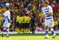 <p>Watford players argue with referee Stuart Attwell after he awards Reading a goal in 2008… </p>