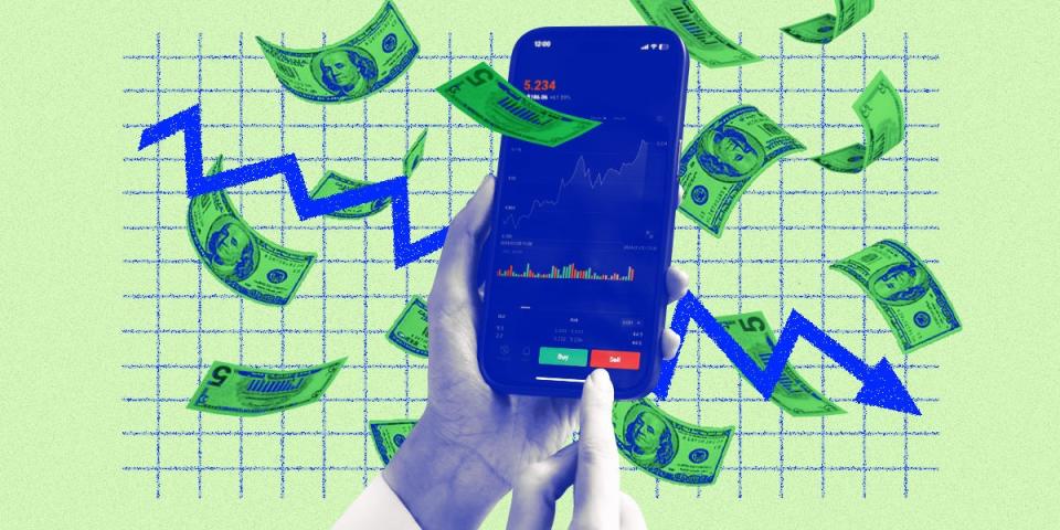 A hand holding a phone with a stock market app on it, in the background cash is falling and trend lines on a grid indicate a downward trend.