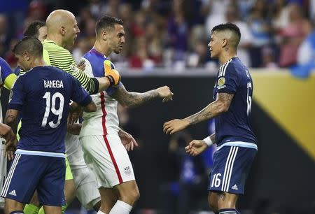 Jun 21, 2016; Houston, TX, USA; United States defender Geoff Cameron (20) and Argentina defender Marcos Rojo (16) exchange words during the first half in the semifinals of the 2016 Copa America Centenario soccer tournament at NRG Stadium. Troy Taormina-USA TODAY Sports