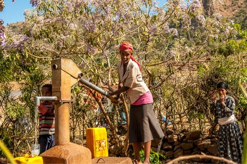 <span class="caption">A woman draws water from a well in Wereta, Ethiopia.</span> <span class="attribution"><a class="link " href="https://www.shutterstock.com/image-photo/wereta-ethiopia-march-232014-drawing-water-187982420?src=aJPKtI-GmkevtB3sVOWVTQ-1-72&studio=1" rel="nofollow noopener" target="_blank" data-ylk="slk:Milosk50/Shutterstock;elm:context_link;itc:0;sec:content-canvas">Milosk50/Shutterstock</a></span>