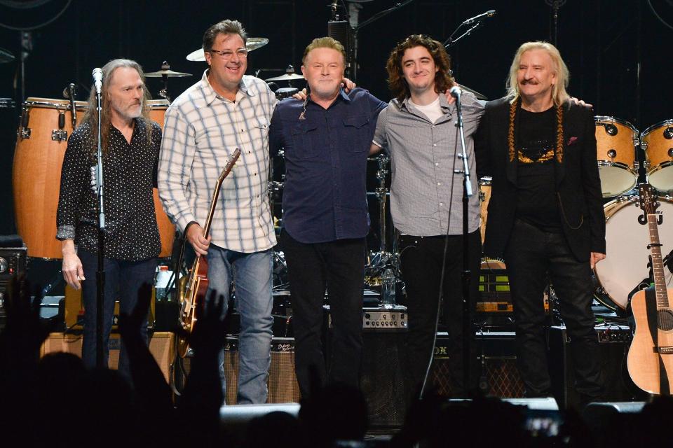 Timothy B. Schmit, Vince Gill, Don Henley, Deacon Frey, and Joe Walsh of the Eagles perform during SiriusXM presents the Eagles in their first ever concert at the Grand Ole Opry House on October 29, 2017 in Nashville, Tennessee