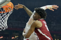 Alabama forward Nick Pringle (23) shoots over UConn center Donovan Clingan (32) during the first half of the NCAA college basketball game at the Final Four, Saturday, April 6, 2024, in Glendale, Ariz. (AP Photo/David J. Phillip)