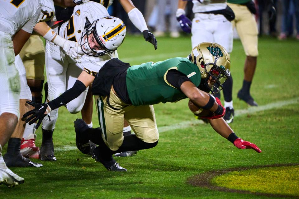 Basha Bears running back Miles Lockhart (1) dives into the end zone as he is brought down by the Saguaro Sabercats during the Open Division state championship game at Sun Devil Stadium in Tempe on Saturday, Dec. 10, 2022.