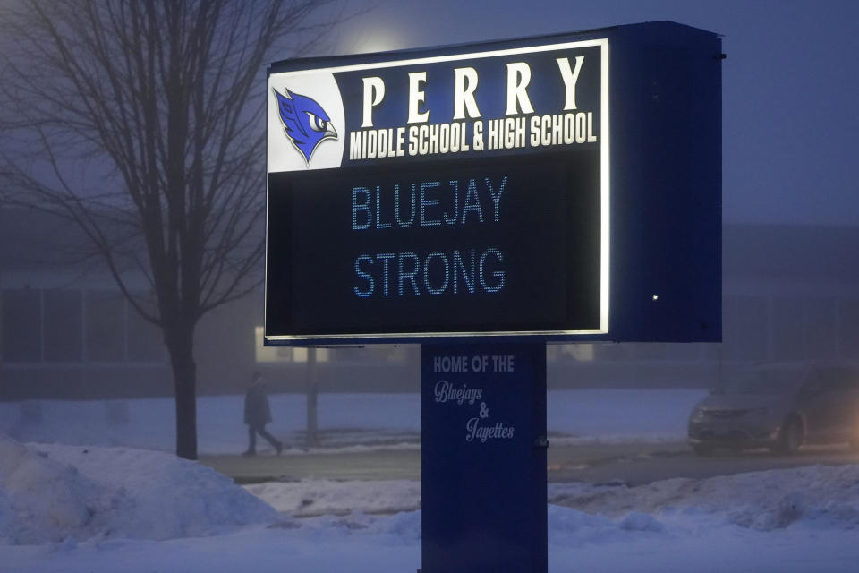 A person arrives at Perry Middle School, Thursday, Jan. 25, 2024, in Perry, Iowa. Middle school students returned to classes Thursday for the first time since a high school student opened fire in a shared cafeteria, killing two people and injuring six others. (AP Photo/Charlie Neibergall)