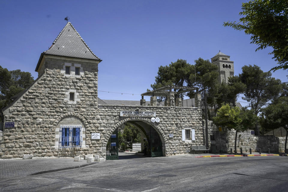 FILE - Augusta Victoria Hospital is seen ahead of a visit by U.S. President Joe Biden, in east Jerusalem, Monday, July 11, 2022. Biden's dash through the Israel and the occupied West Bank this week is expected to cut across some of the region's most iconic places. Most of his travels are focused on business. But in between his meetings with Israeli and Palestinian leaders, he will visit a host of well-known sites while staying at a historic Jerusalem hotel. (AP Photo/Mahmoud Illean, File)