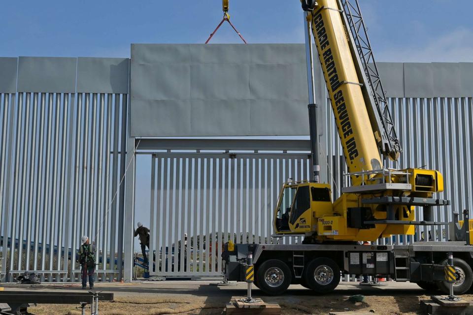 PHOTO: Workers erect a gate in a new stretch of wall at the Friendship Park site at the San Diego-Tijuana border crossing on Aug. 2, 2023. (Carlos Moreno/Picture Alliance via Getty Images)