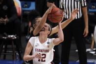 Stanford guard Lexie Hull (12) looks to shoot over South Carolina guard Brea Beal, rear, during the first half of a women's Final Four NCAA college basketball tournament semifinal game Friday, April 2, 2021, at the Alamodome in San Antonio. (AP Photo/Morry Gash)