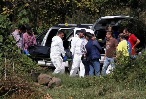 A team of forensic experts works on November 6 at the site of the attack