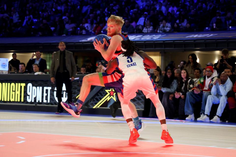 Feb 16, 2024; Indianapolis, IN, USA; Tristan Jass (22) of Team Stephen A controls the ball against Kai Cenat (3) of Team Shannon in the second quarter during the All Star Celebrity Game at Lucas Oil Stadium. Mandatory Credit: Trevor Ruszkowski-USA TODAY Sports