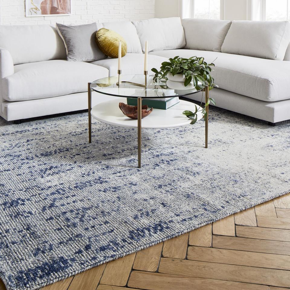 7) Distressed Foliage Rug