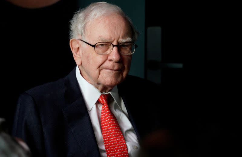 FILE PHOTO: FILE PHOTO: Warren Buffett, CEO of Berkshire Hathaway Inc, pauses while playing bridge as part of the company annual meeting weekend in Omaha