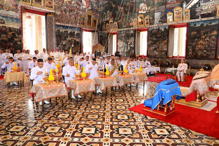 Royal astrologers and members of the Royal Thai court participate in a ritual ahead of the coronation to inscribe Thai King Maha Vajiralongkorn's name and title, cast the king's horoscope, and engrave the king's official seal at the Wat Phra Kaew or the Temple of the Emerald Buddha in Bangkok, Thailand April 23, 2019. Thailand Royal Household via REUTERS