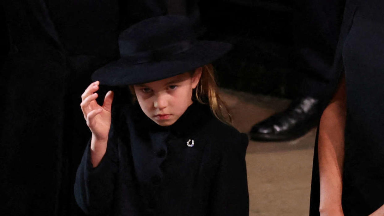 (From L) Britain's Prince George of Wales, Britain's Katharine, Duchess of Kent, Britain's Princess Charlotte of Wales and Meghan, Duchess of Sussex attend the state funeral and burial of Britain's Queen Elizabeth, at Westminster Abbey in London, Britain, September 19, 2022. (Photo by PHIL NOBLE / POOL / AFP)
