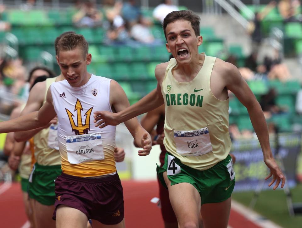 Oregon's Elliott Cook, right, leans into his finish in the men's 800 meters at the Pac-12 Track & Field Championships at Hayward Field in Eugene, Oregon May 15, 2022.