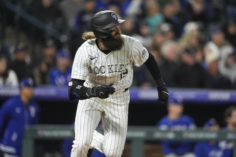 Colorado Rockies' Charlie Blackmon heads up the first base line after connecting for a double to drive in two runs off Texas Rangers relief pitcher Yerry Rodríguez in the eighth inning of a baseball game Friday, May 10, 2024, in Denver. (AP Photo/David Zalubowski)