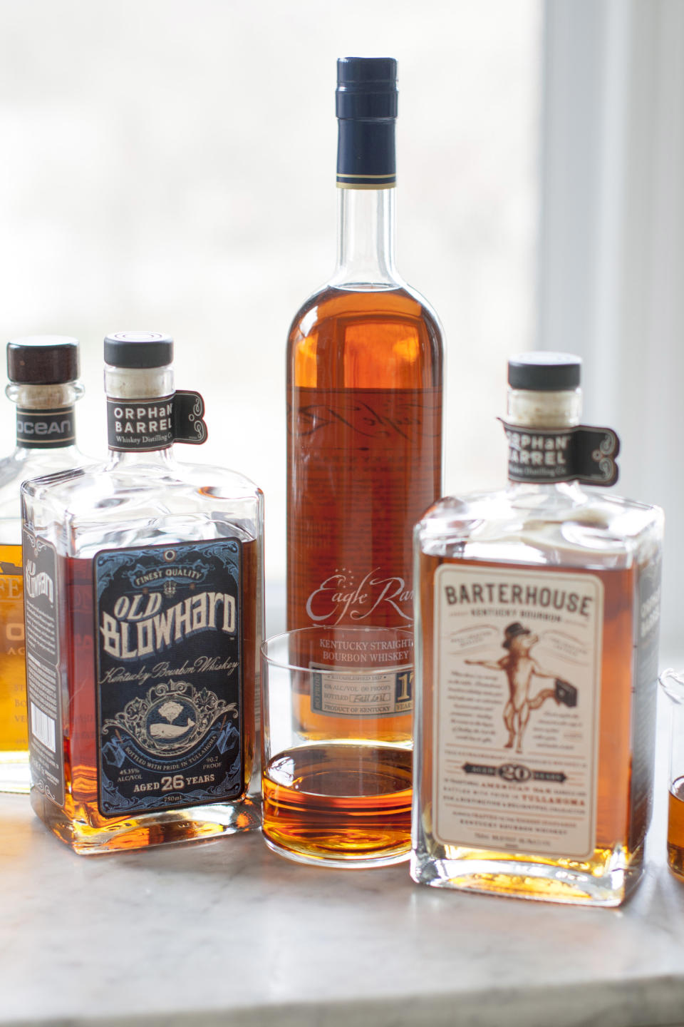 This Apr. 7, 2014 photo shows Jefferson's Ocean, Old Blowhard, Eagle Rare, and Barterhouse bourbons in Concord, N.H. All are part of a bourbon renaissance that has seen a new appreciation of American whiskey, as well as the birth of a whole new class of cult spirits. (AP Photo/Matthew Mead)