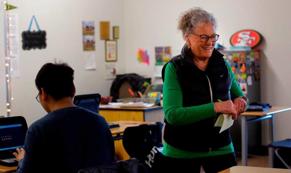 Special education paraeducator Nan Duncan smiles after recently helping a Richland High student successfully complete a classroom assignment. She has spent the past 34 years supporting Richland students receiving special education services and Richland School District leaders have nominated her for state Classified School Employee of the Year.