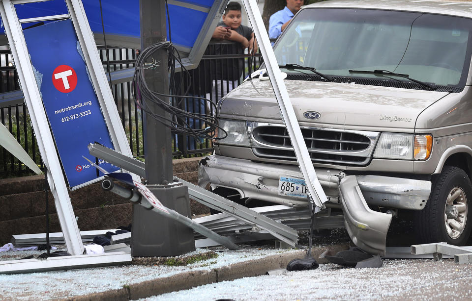 At least six people were hurt, including three critically, when a van slammed into a crowded bus stop shelter in north Minneapolis. All six were transported to hospitals. Metro Transit spokesman Howie Padilla says police took the driver of the van into custody following the crash about 9:30 a.m. Tuesday, July 9, 2019. (David Joles/Star Tribune via AP)