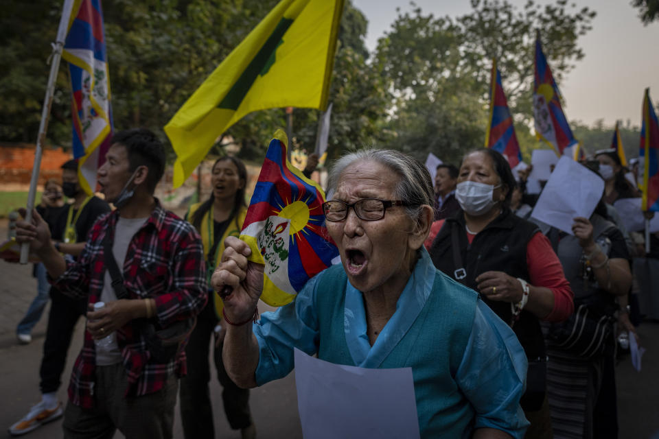 Exile Tibetan activists hold blank white papers symbolizing government censorship in China, while shouting anti-China slogans during a protest in New Delhi, India, Friday, Dec. 2, 2022. The protest was in solidarity with the on-going "White Paper" protests against Chinese government's continued zero-COVID policies. (AP Photo/Altaf Qadri)