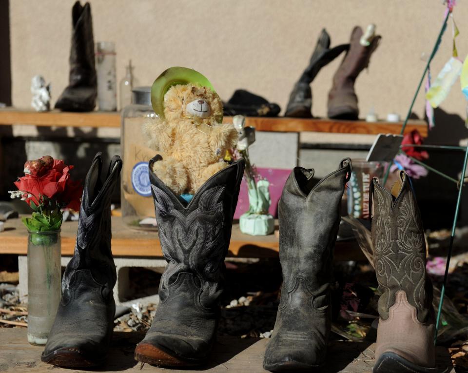 Boots adorn the outside the Borderline Bar & Grill in Thousand Oaks on Wednesday, Jan. 20, 2021. They are part of the memorials to the 12 people killed at the club during a mass shooting on Nov. 7, 2018.