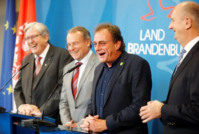 Brandenburg's Prime Minister Dietmar Woidke, state Minister for Economy and Energy Joerg Steinbach and head of the district Oder-Spree authority Rolf Lindemann address media on Tesla European factory in Potsdam