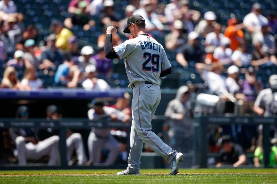 Miami Marlins starting pitcher Braxton Garrett (29) gestures as he walks to the dugout at the end of the second inning against the Colorado Rockies at Coors Field.