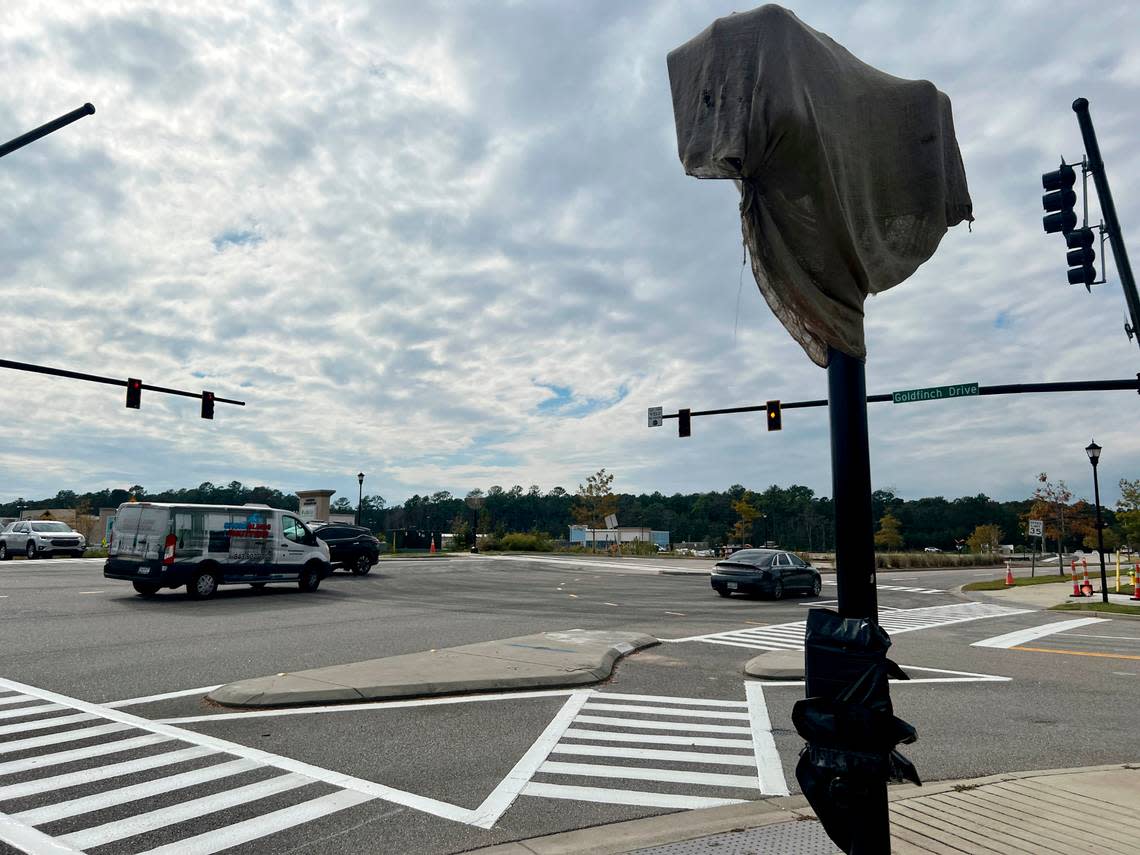 New traffic lights and pedestrian walks have been constructed at Coventry Boulevard and Goldfinch Drive as part of the development of a new Publix shopping center as well as out parcels and a gas station being built on the site near The Market Common. October 11, 2022.