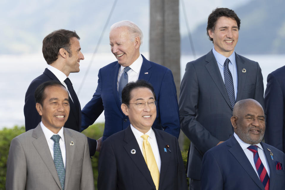 Front row from left, Indonesia's President Joko Widodo, Japan's Prime Minister Fumio Kishida and Comoros President Azali Assoumani, back row from left, French President Emmanuel Macron, US President Joe Biden, Canada's Prime Minister Justin Trudeau take part in a group photo at the Grand Prince Hotel, during the G7 Summit in Hiroshima, Japan. at the G7 Summit in Hiroshima, Japan, Saturday, May 20, 2023. (Stefan Rousseau/Pool via AP)