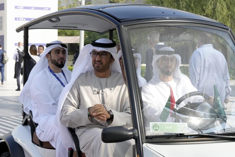 COP28 President Sultan al-Jaber, rides in a cart through the COP28 U.N. Climate Summit, Saturday, Dec. 9, 2023, in Dubai, United Arab Emirates. (AP Photo/Peter Dejong)