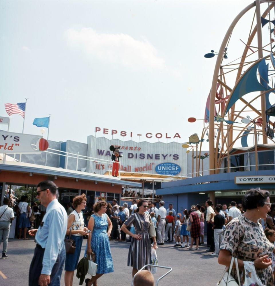 1964 New York World's Fair with visitors. Signage for Pepsi-Cola and Walt Disney's 