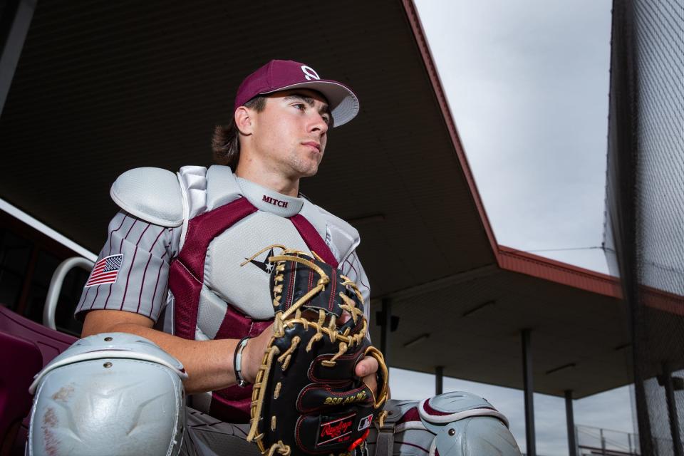 Sinton senior Blake Mitchell, 18, wears his catcher's gear and sits in the stands at the high school's baseball field, Feb. 16, 2023, in Sinton, Texas.