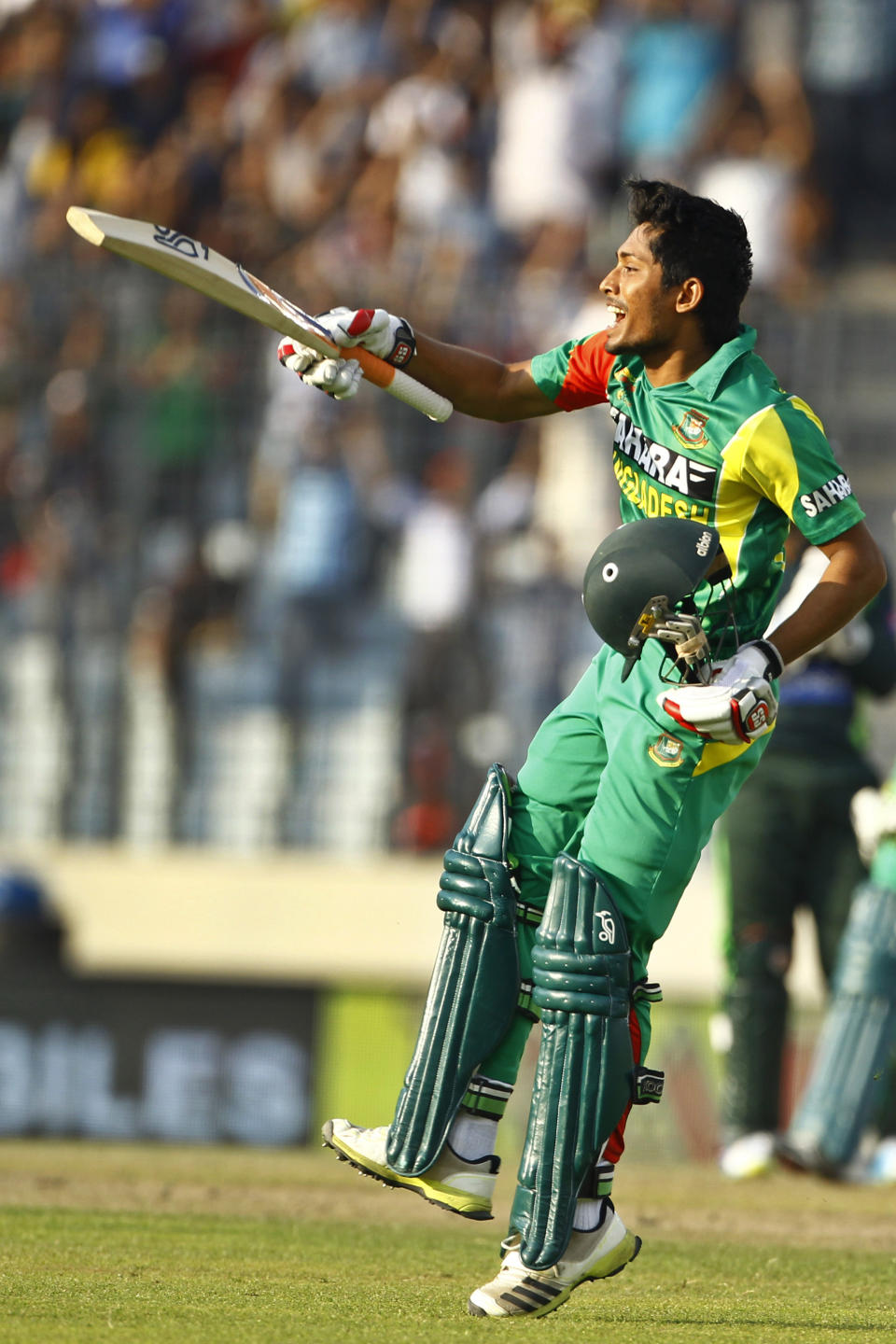 Bangladesh’s Anamul Haque celebrates after scoring a century during their match against Pakistan in the Asia Cup one-day international cricket tournament in Dhaka, Bangladesh, Tuesday, March 4, 2014. (AP Photo/A.M. Ahad)