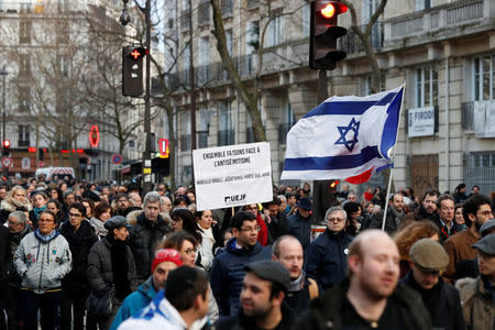 People and officials attend a gathering, organised by the CRIF Jewish organisation, in memory of Mireille Knoll, in Paris, France, March 28, 2018. REUTERS/Gonzalo Fuentes